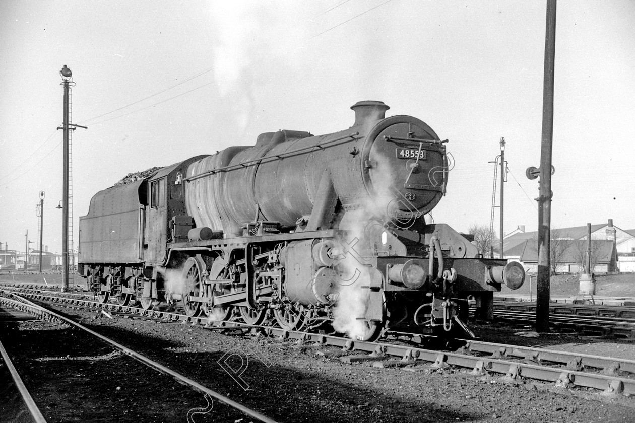 WD2062 
 ENGINE CLASS: Stanier Class 8 2-8-0 ENGINE NUMBER: 48553 LOCATION: Patricroft DATE: 04 February 1964 COMMENTS: 
 Keywords: 04 February 1964, 48553, Cooperline, Patricroft, Stanier Class 8 2-8-0, Steam, WD Cooper, locomotives, railway photography, trains